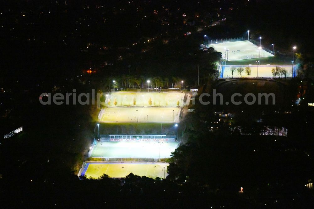 Berlin at night from the bird perspective: Night lighting Ensemble of sports grounds Ernst-Reuter-Sportfeld Onkel-Tom-Strasse in the district Zehlendorf in Berlin, Germany