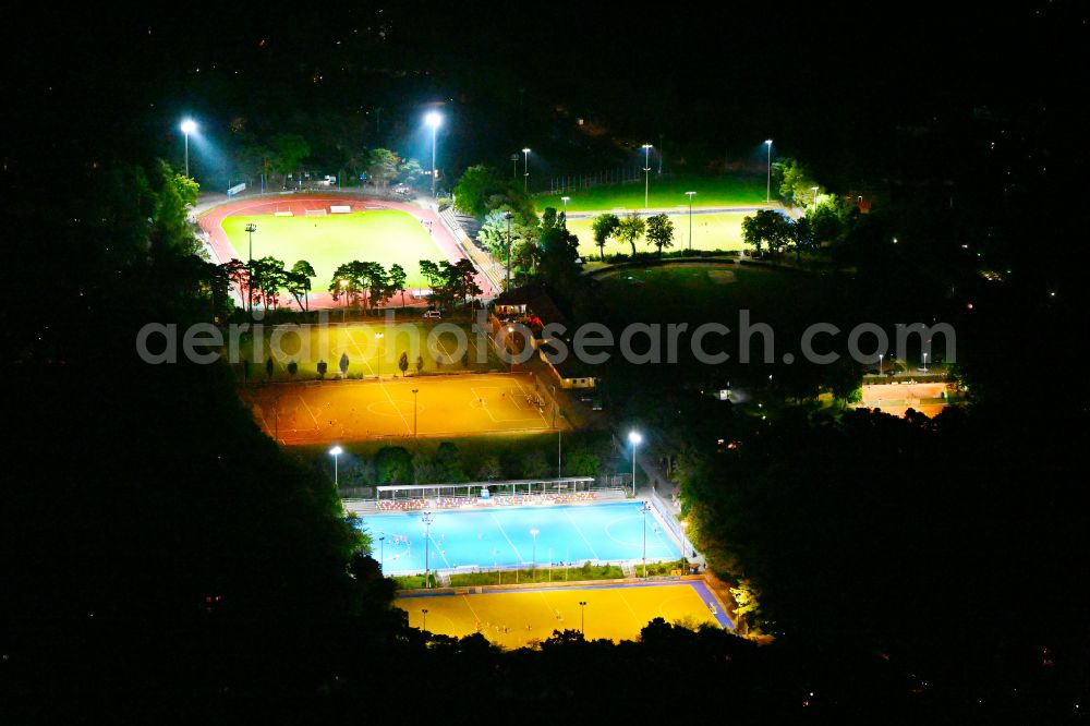 Berlin at night from above - Night lighting Ensemble of sports grounds Ernst-Reuter-Sportfeld Onkel-Tom-Strasse in the district Zehlendorf in Berlin, Germany