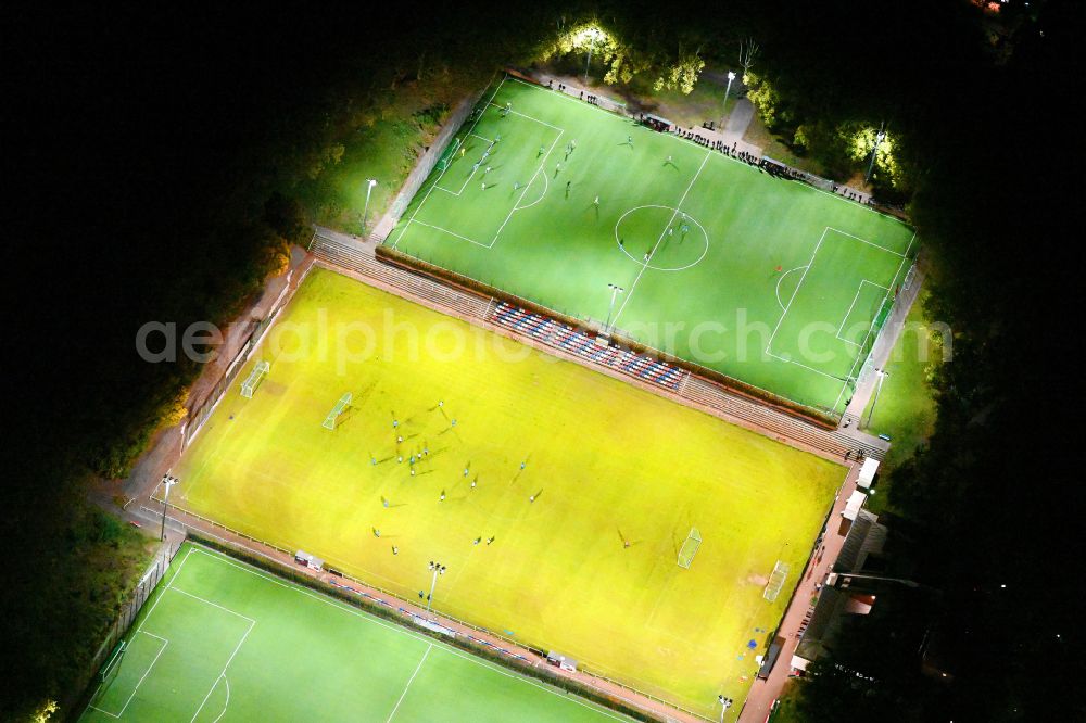 Berlin at night from above - Night lights and lighting ensemble of the Werner-Seelenbinder-Sportpark sports grounds of SV Tasmania Berlin eV on Oderstrasse in the Neukoelln district of Berlin