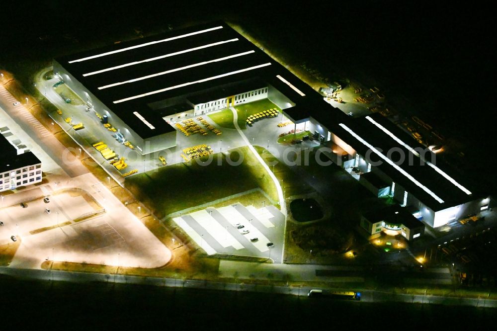 Aerial image at night Hörselberg-Hainich - Night lighting buildings and production halls on the vehicle construction site of Bell Equipment GmbH in Hoerselberg-Hainich in the state Thuringia, Germany