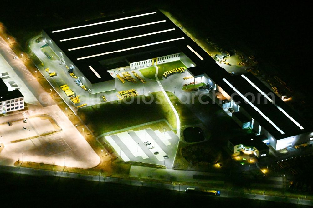 Hörselberg-Hainich at night from above - Night lighting buildings and production halls on the vehicle construction site of Bell Equipment GmbH in Hoerselberg-Hainich in the state Thuringia, Germany