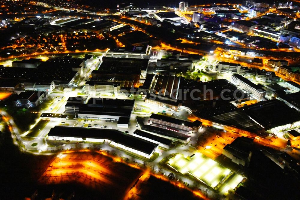 Aerial photograph at night Stuttgart - Night lighting buildings and production halls on the vehicle construction site of Robert Bosch GmbH Feuerbach on Wernerstrasse in the district Siegelberg in Stuttgart in the state Baden-Wurttemberg, Germany