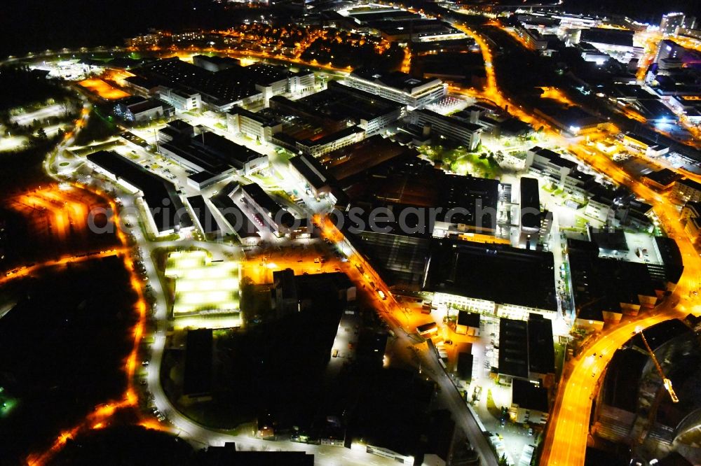 Stuttgart at night from above - Night lighting buildings and production halls on the vehicle construction site of Robert Bosch GmbH Feuerbach on Wernerstrasse in the district Siegelberg in Stuttgart in the state Baden-Wurttemberg, Germany