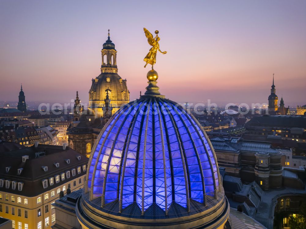 Dresden at night from above - Night lights and lighting sight and tourist attraction of the historical monument Kunsthalle Oktogon im Lipsius-Bau with the sculpture of the golden Fama on the Bruehlsche Terrasse in the Altstadt district of Dresden in the federal state of Saxony, Germany