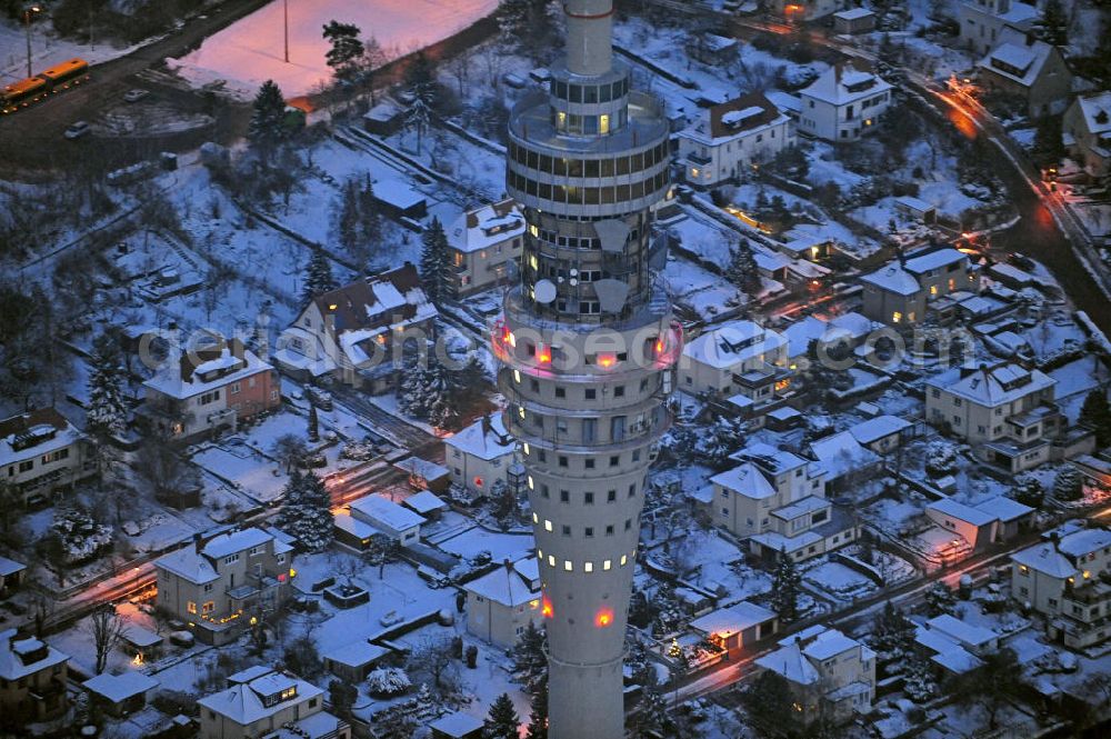 Dresden at night from the bird perspective: Nachtluftbild vom Dresdner Fernsehturm und den winterlich verschneiten Stadtteil Wachwitz mit schneebedeckten Dächern. View of the Dresden TV tower and thewintery area Wachwitz with snow-covered roofs.