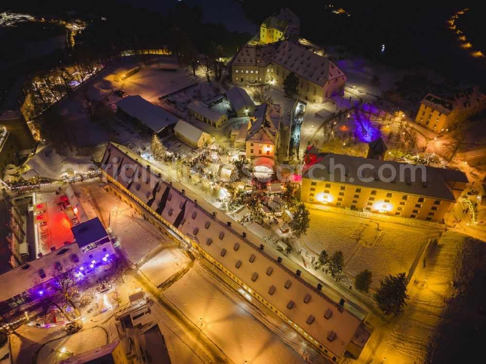 Königstein at night from above - Night lighting the Fortress Koenigstein at the river Elbe in the county district of Saxon Switzerland East Erzgebirge in the state of Saxony. The fortress is one of the largest mountain fortresses in Europe and is located amidst the Elbe sand stone mountains on the flat top mountain of the same name