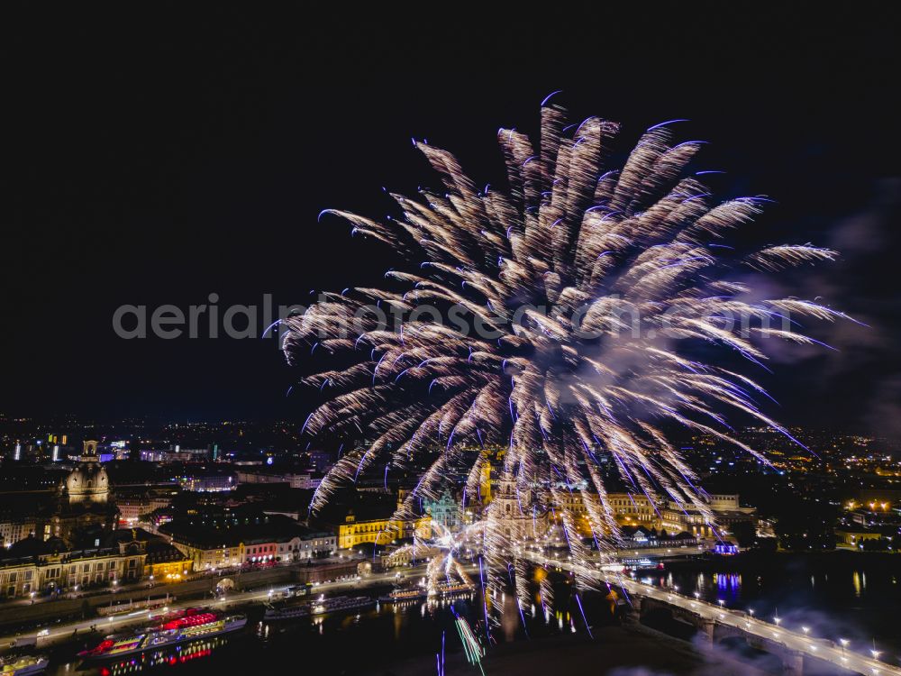 Dresden at night from the bird perspective: Fireworks figures in the night sky above the event grounds of Elbwiesen on street Koenigsufer in the district Altstadt in Dresden in the state Saxony, Germany