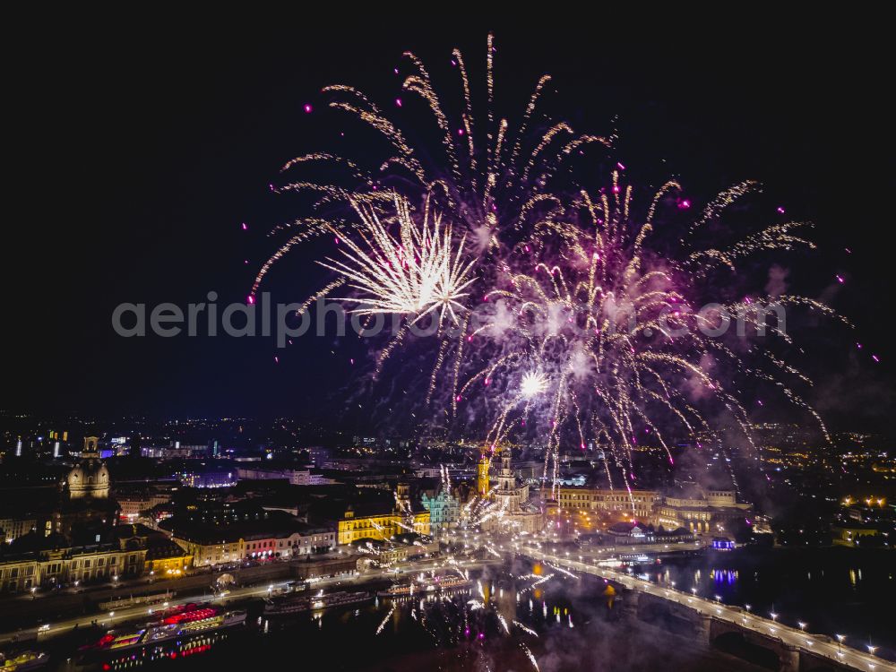 Aerial image at night Dresden - Fireworks figures in the night sky above the event grounds of Elbwiesen on street Koenigsufer in the district Altstadt in Dresden in the state Saxony, Germany