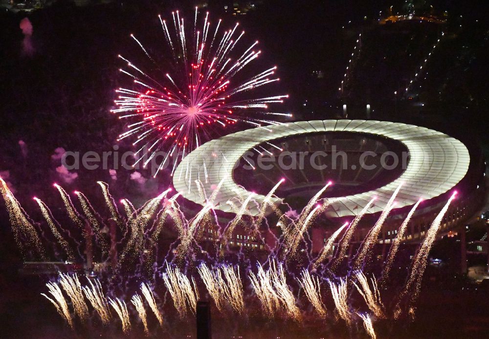 Aerial image at night Berlin - Night lighting Fireworks figures in the night sky above the event grounds of Pyronale Fireworks Competition at the Olympic Stadium in the district Charlottenburg in Berlin, Germany