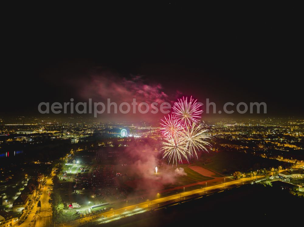 Aerial image at night Dresden - Night lighting fireworks figures in the night sky above the event grounds Pyrogames on street Messering in the district Friedrichstadt in Dresden in the state Saxony, Germany