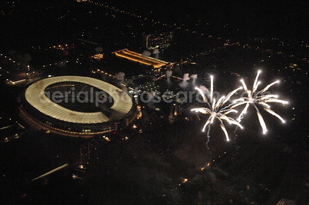 Aerial photograph at night Berlin - Fireworks figures in the night sky above the event grounds Pyronale on Maifeld in the district Charlottenburg-Wilmersdorf in Berlin, Germany