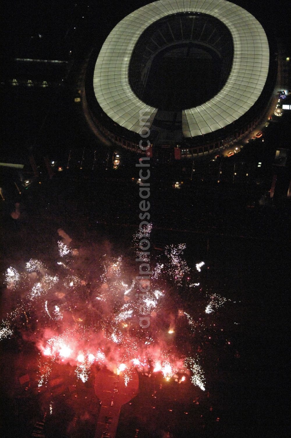 Aerial image at night Berlin - Fireworks figures in the night sky above the event grounds Pyronale on Maifeld in the district Charlottenburg-Wilmersdorf in Berlin, Germany