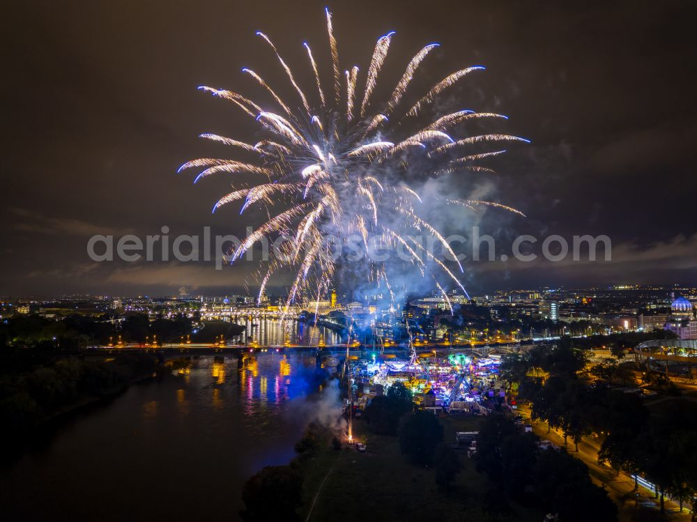 Aerial image at night Dresden - Night lighting fireworks figures in the night sky above the event grounds of Volksfestgelaende on street Pieschener Allee in the district Friedrichstadt in Dresden in the state Saxony, Germany