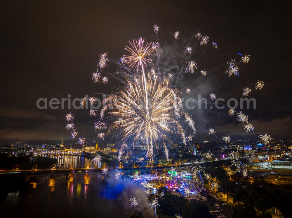 Dresden at night from the bird perspective: Night lighting fireworks figures in the night sky above the event grounds of Volksfestgelaende on street Pieschener Allee in the district Friedrichstadt in Dresden in the state Saxony, Germany