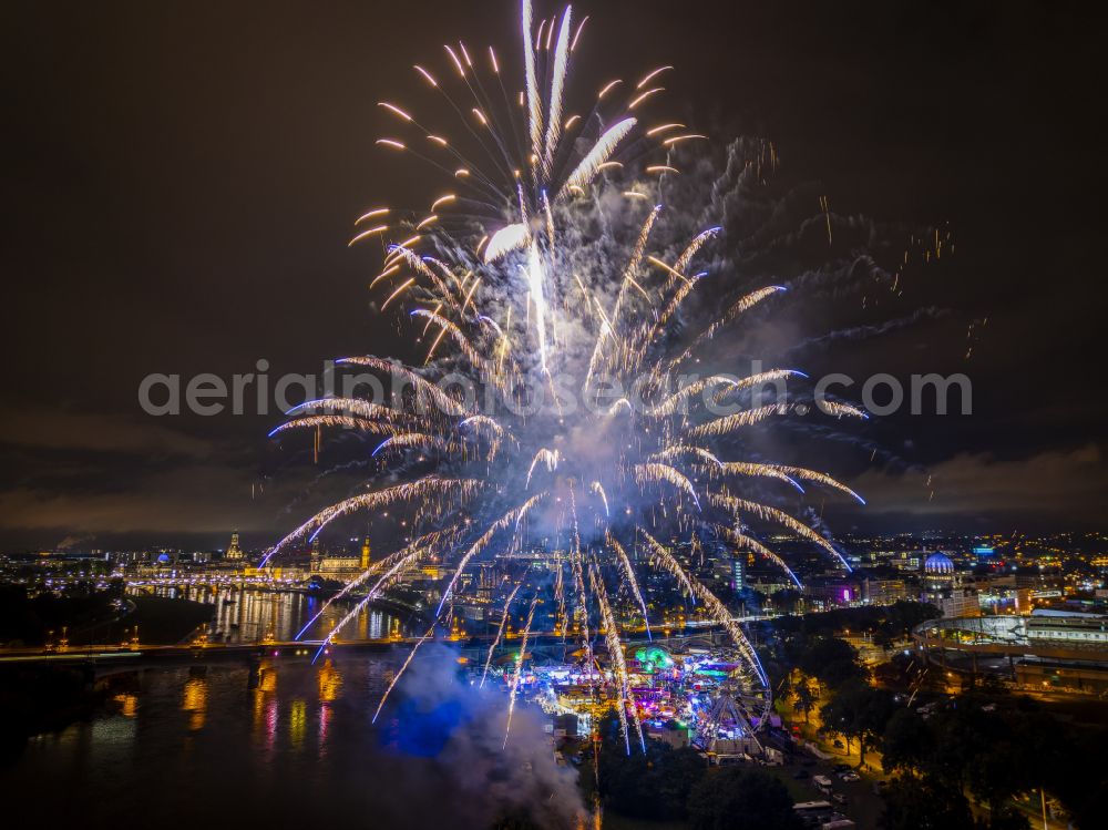 Aerial photograph at night Dresden - Night lighting fireworks figures in the night sky above the event grounds of Volksfestgelaende on street Pieschener Allee in the district Friedrichstadt in Dresden in the state Saxony, Germany