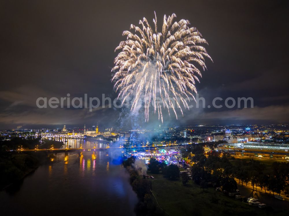 Aerial image at night Dresden - Night lighting fireworks figures in the night sky above the event grounds of Volksfestgelaende on street Pieschener Allee in the district Friedrichstadt in Dresden in the state Saxony, Germany