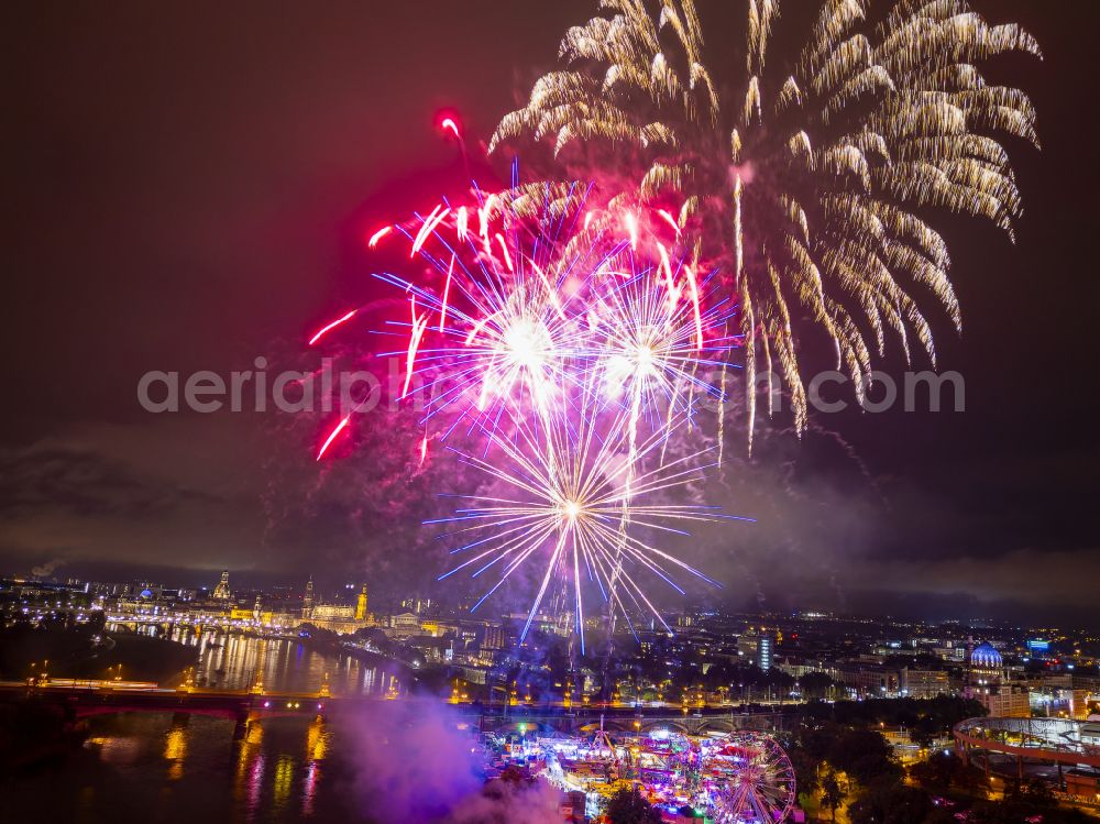 Dresden at night from the bird perspective: Night lighting fireworks figures in the night sky above the event grounds of Volksfestgelaende on street Pieschener Allee in the district Friedrichstadt in Dresden in the state Saxony, Germany