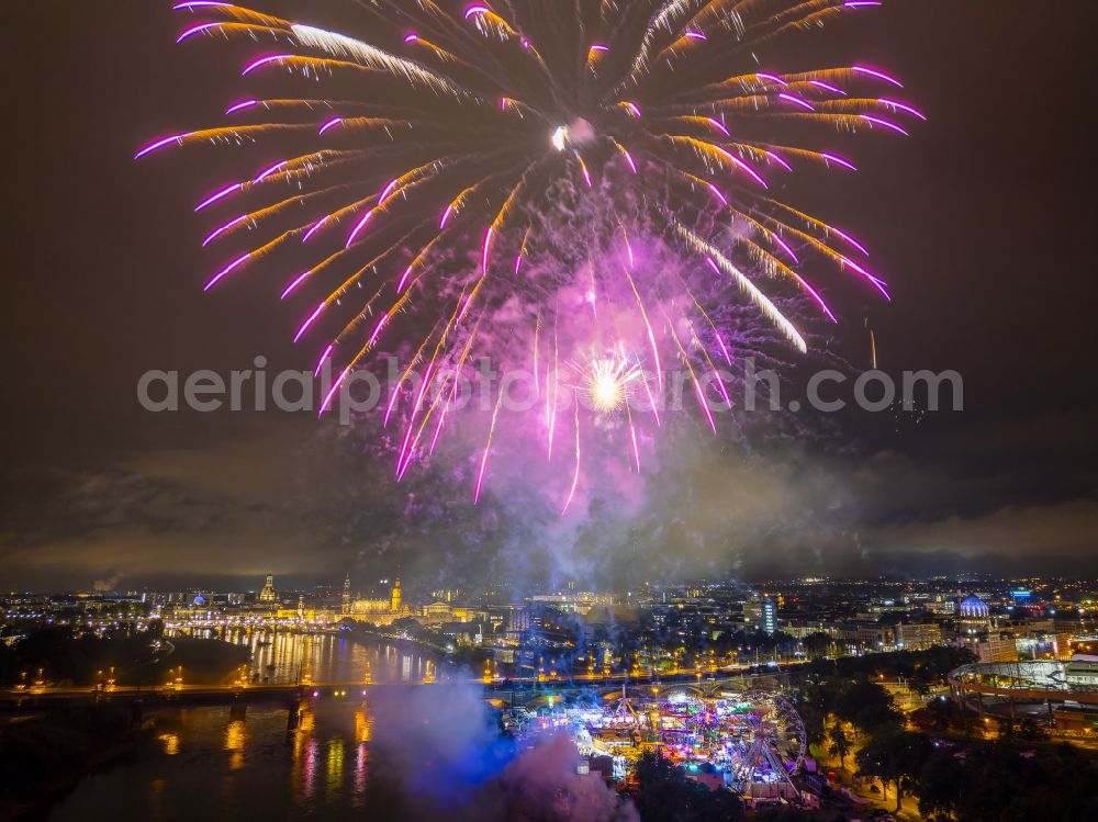 Aerial image at night Dresden - Night lighting fireworks figures in the night sky above the event grounds of Volksfestgelaende on street Pieschener Allee in the district Friedrichstadt in Dresden in the state Saxony, Germany