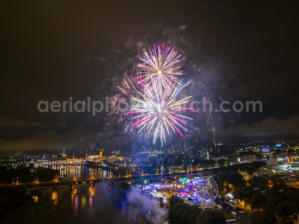 Dresden at night from the bird perspective: Night lighting fireworks figures in the night sky above the event grounds of Volksfestgelaende on street Pieschener Allee in the district Friedrichstadt in Dresden in the state Saxony, Germany