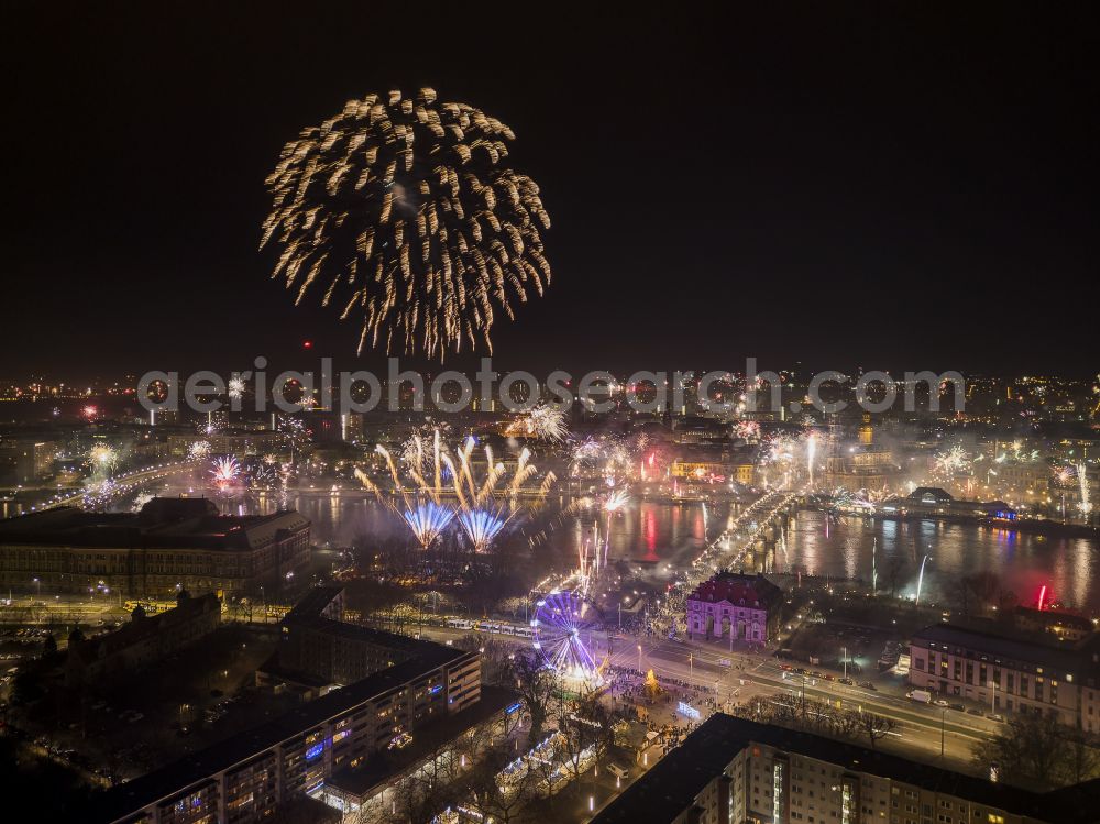 Aerial photograph at night Dresden - Night lights and lighting fireworks figures in the night sky for New Years Eve on the banks of the Elbe at the Augustusbruecke street in Dresden in the state of Saxony, Germany