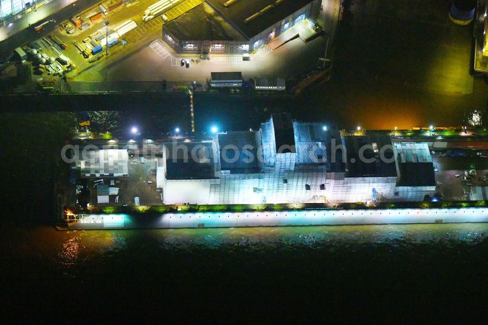 Aerial photograph at night Hamburg - Night lighting ferry ship SPIRIT OF FRANCE on Shipyard on the elbe banks in Hamburg, Germany