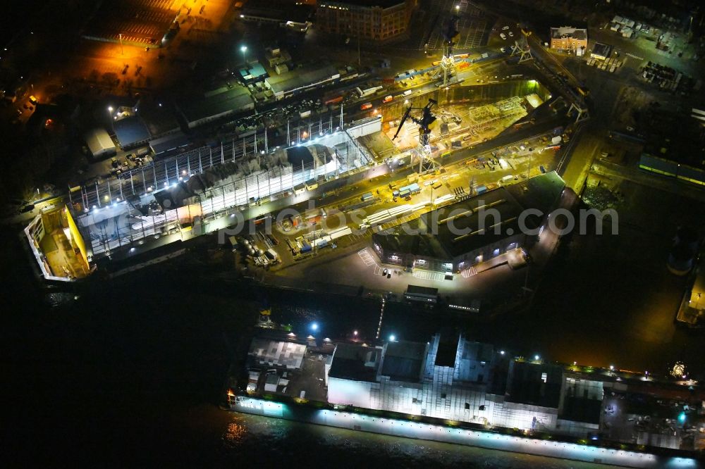 Aerial image at night Hamburg - Night lighting ferry ship SPIRIT OF FRANCE on Shipyard on the elbe banks in Hamburg, Germany