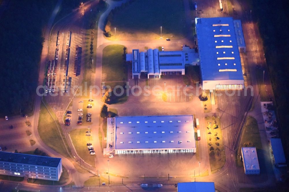 Aerial image at night Schwerin - Night lighting Company grounds and facilities of Nahverkehr Schwerin GmbH in of Ludwigsluster Chaussee in Schwerin in the state Mecklenburg - Western Pomerania, Germany