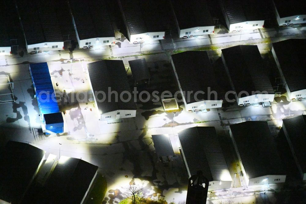 Aerial image at night Leipzig - Night lighting Container settlement as temporary shelter and reception center for refugees Graf-Zeppelin-Ring - Am alten Flughafen in the district Nordost in Leipzig in the state Saxony, Germany