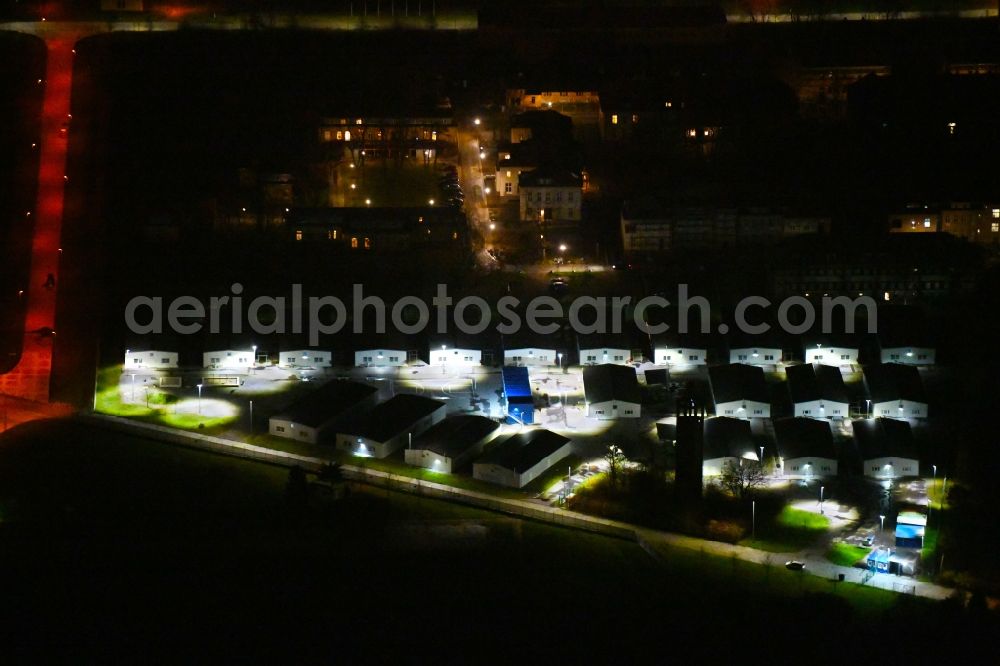 Aerial photograph at night Leipzig - Night lighting Container settlement as temporary shelter and reception center for refugees Graf-Zeppelin-Ring - Am alten Flughafen in the district Nordost in Leipzig in the state Saxony, Germany