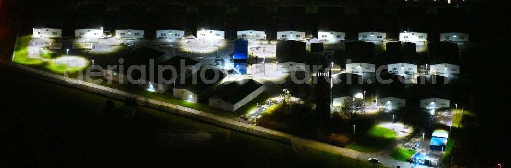 Aerial image at night Leipzig - Night lighting Container settlement as temporary shelter and reception center for refugees Graf-Zeppelin-Ring - Am alten Flughafen in the district Nordost in Leipzig in the state Saxony, Germany