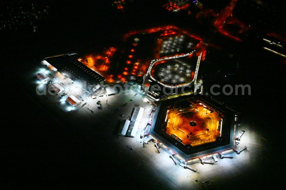 Berlin at night from the bird perspective: Night lighting refugees Home camp as temporary shelter on the former Flughafen- Gelaende in Berlin, Germany