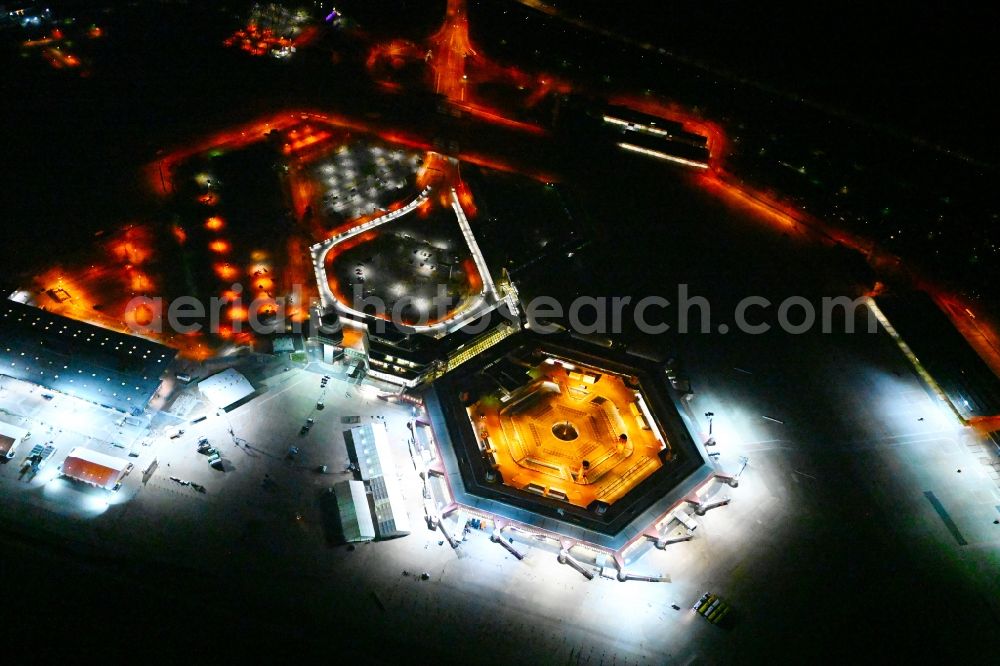 Aerial image at night Berlin - Night lighting refugees Home camp as temporary shelter on the former Flughafen- Gelaende in Berlin, Germany