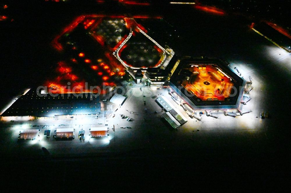 Berlin at night from the bird perspective: Night lighting refugees Home camp as temporary shelter on the former Flughafen- Gelaende in Berlin, Germany