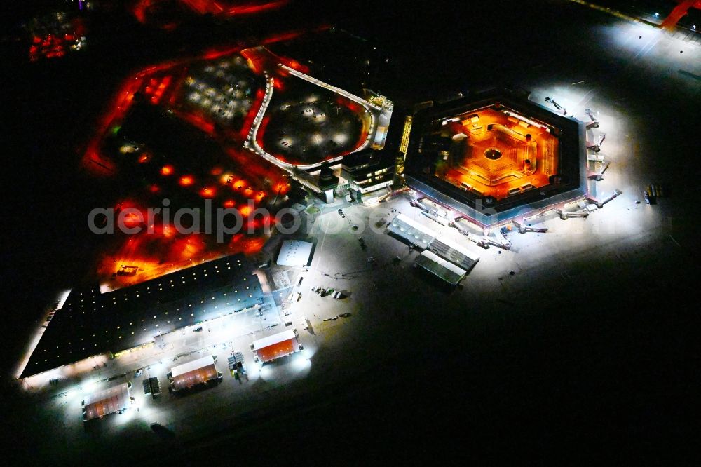 Aerial photograph at night Berlin - Night lighting refugees Home camp as temporary shelter on the former Flughafen- Gelaende in Berlin, Germany