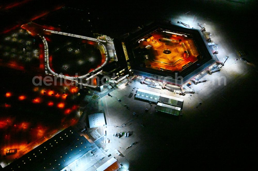 Berlin at night from above - Night lighting refugees Home camp as temporary shelter on the former Flughafen- Gelaende in Berlin, Germany