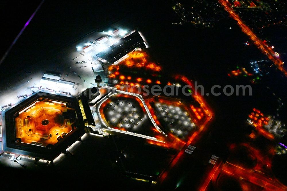 Aerial photograph at night Berlin - Night lighting refugees Home camp as temporary shelter on the former Flughafen- Gelaende in Berlin, Germany