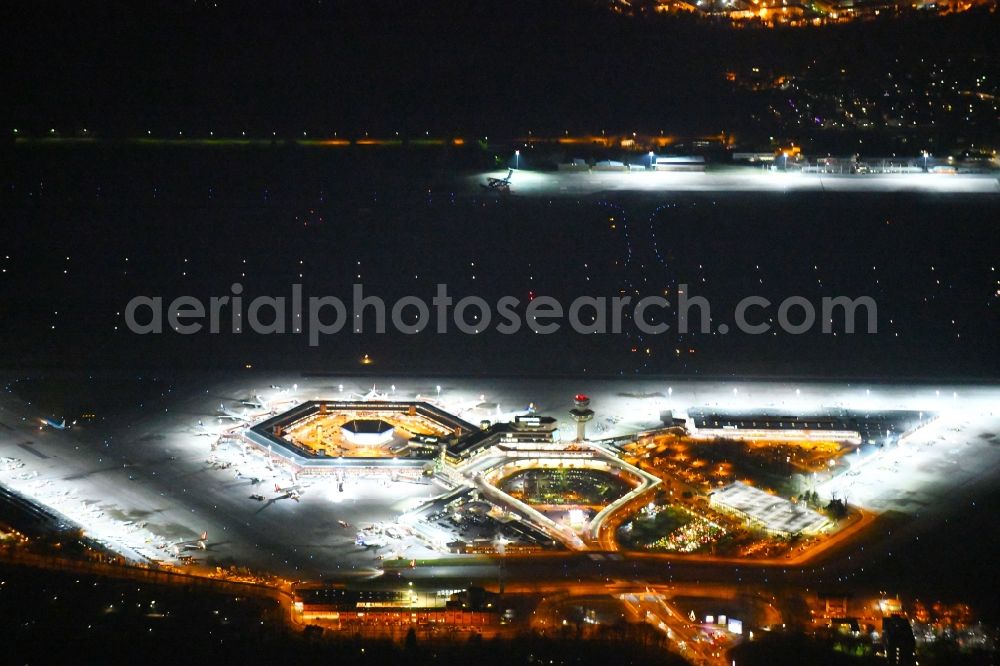 Berlin at night from above - Night lighting Flight operations at the terminal of the airport Berlin - Tegel