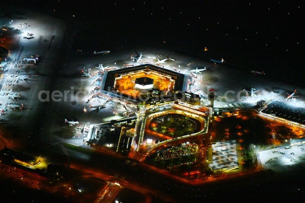 Aerial image at night Berlin - Night lighting Flight operations at the terminal of the airport Berlin - Tegel