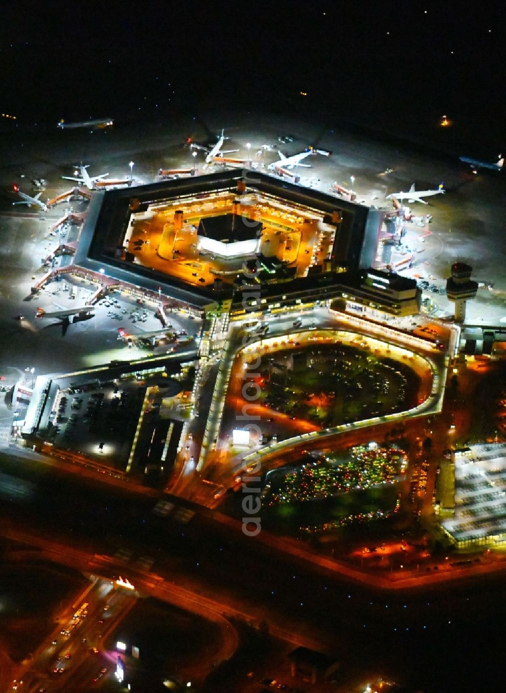 Berlin at night from above - Night lighting Flight operations at the terminal of the airport Berlin - Tegel