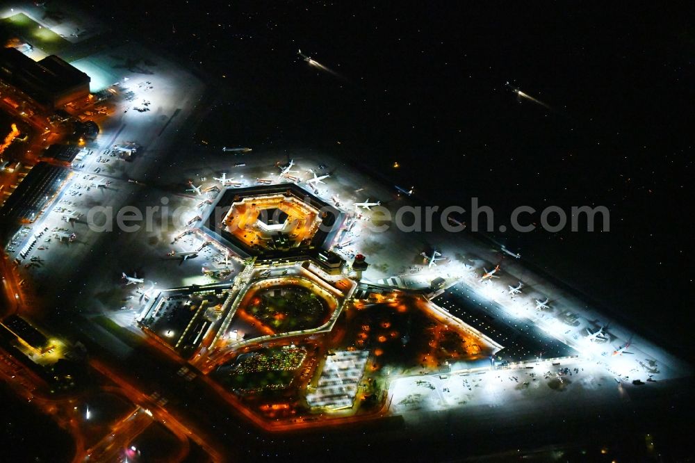 Aerial photograph at night Berlin - Night lighting Flight operations at the terminal of the airport Berlin - Tegel