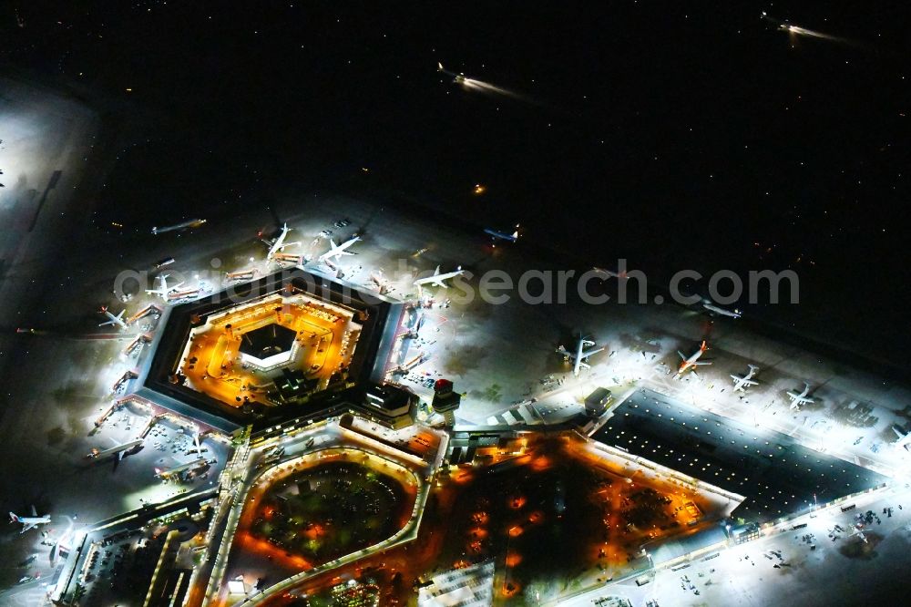 Aerial photograph at night Berlin - Night lighting Flight operations at the terminal of the airport Berlin - Tegel