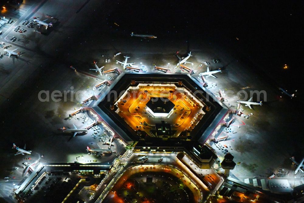 Berlin at night from above - Night lighting Flight operations at the terminal of the airport Berlin - Tegel