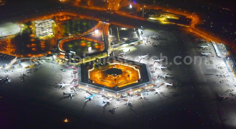 Aerial image at night Berlin - Night lighting Flight operations at the terminal of the airport Berlin - Tegel