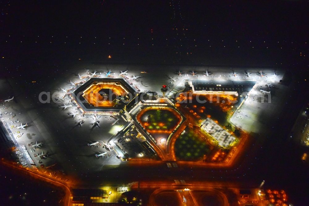 Berlin at night from above - Night lighting Flight operations at the terminal of the airport Berlin - Tegel