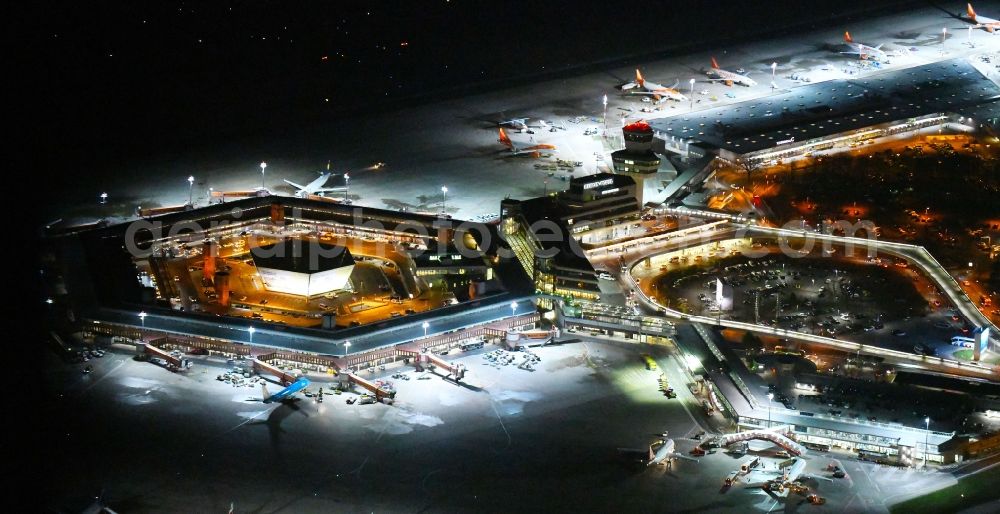 Aerial photograph at night Berlin - Night lighting Flight operations at the terminal of the airport Berlin - Tegel