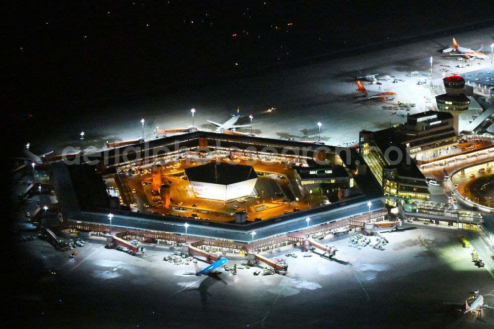 Aerial image at night Berlin - Night lighting Flight operations at the terminal of the airport Berlin - Tegel