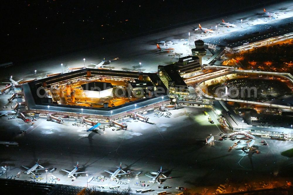 Berlin at night from above - Night lighting Flight operations at the terminal of the airport Berlin - Tegel