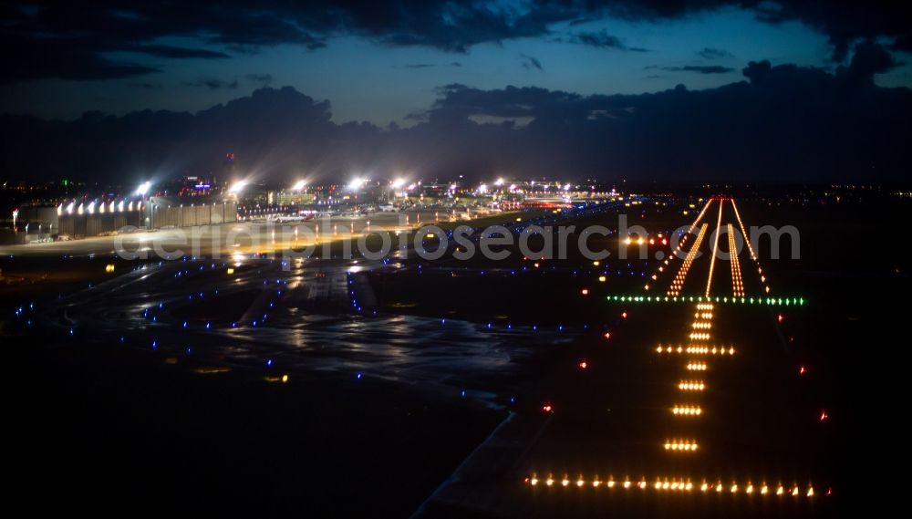 Aerial photograph at night Düsseldorf - Night lighting airport runways in Duesseldorf in the state North Rhine-Westphalia, Germany