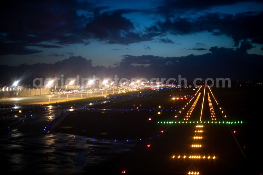 Aerial image at night Düsseldorf - Night lighting airport runways in Duesseldorf in the state North Rhine-Westphalia, Germany