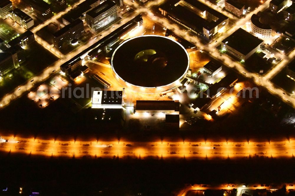 Berlin at night from the bird perspective: Night lighting research building and office complex Elektronen- Speicherring BESSY - Synchrotronstrahlungsquelle in the district Adlershof in Berlin, Germany